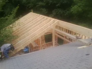 Framing a new roof addition that ties into an existing shingle roof in Clinton Township